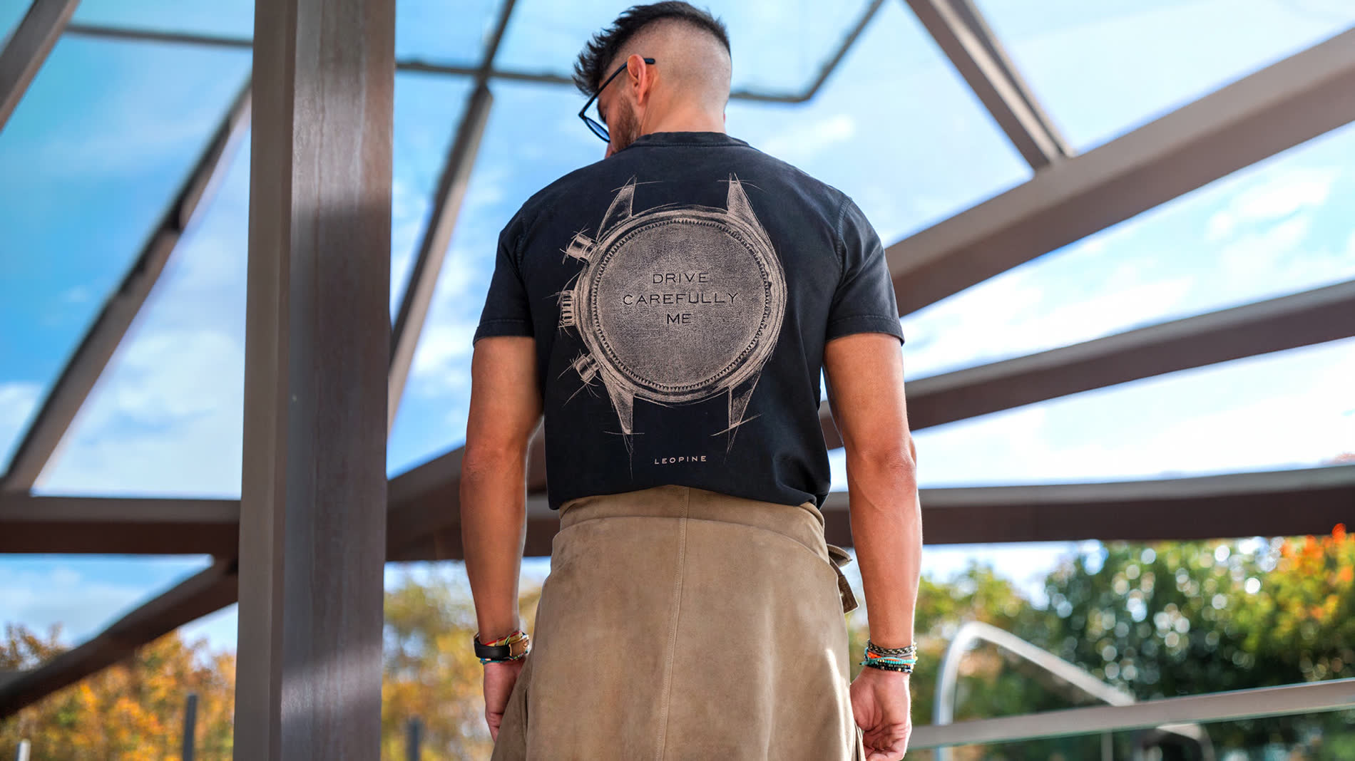 The Drive Carefully tee, a vintage chronograph sketched on the back